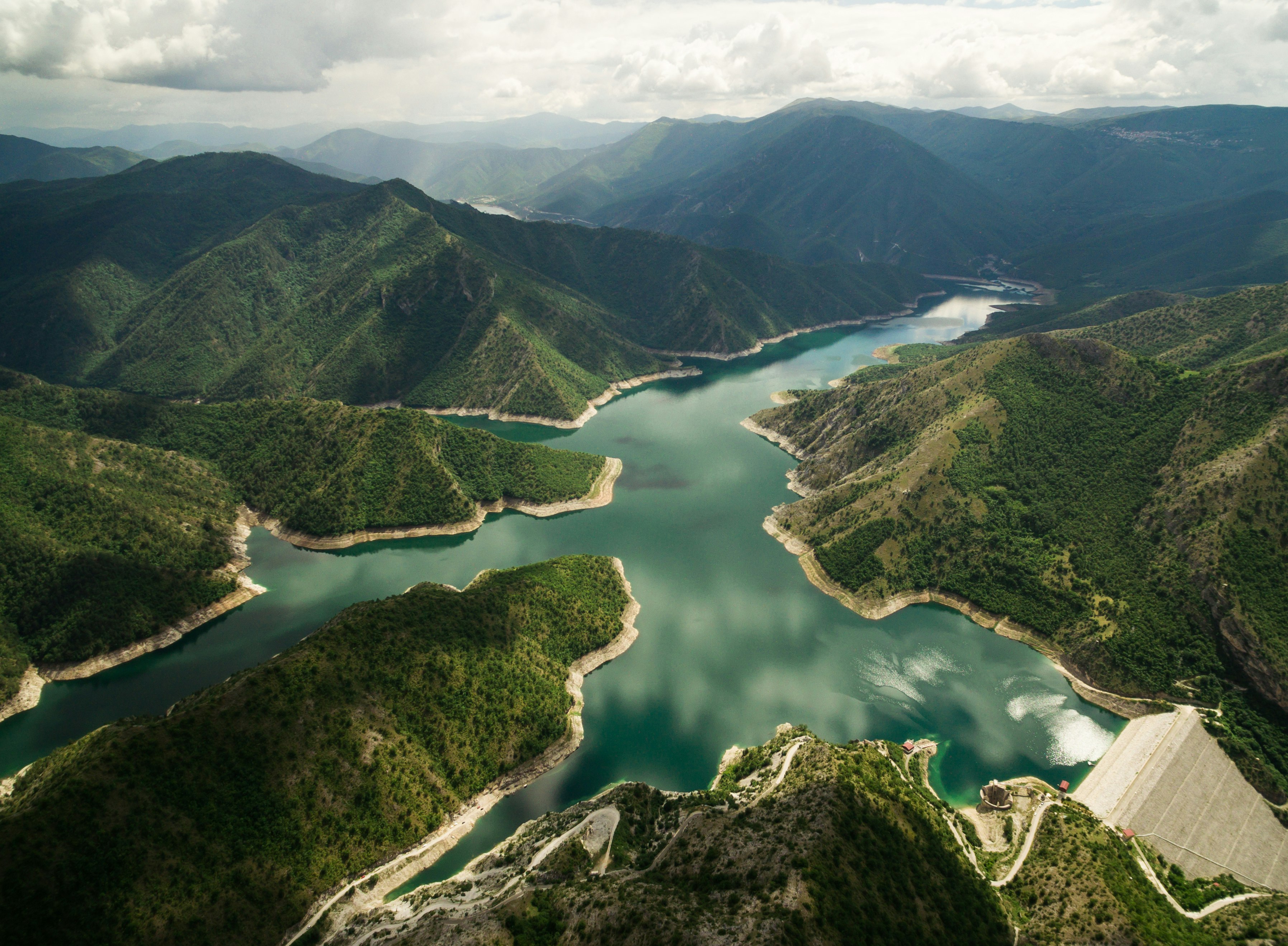 bird's eye view of river surrounded by mountains